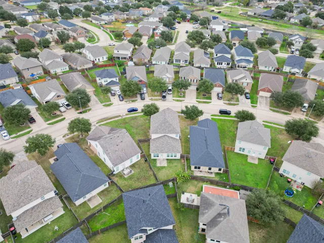 an aerial view of a city with lots of residential buildings