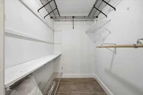 a bedroom with a bed and a table