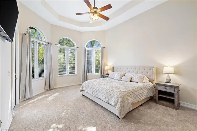 a bedroom with a bed lamps and window