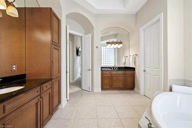 a kitchen with a refrigerator and a stove top oven