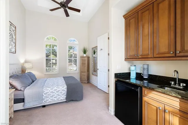a bedroom with furniture and a window