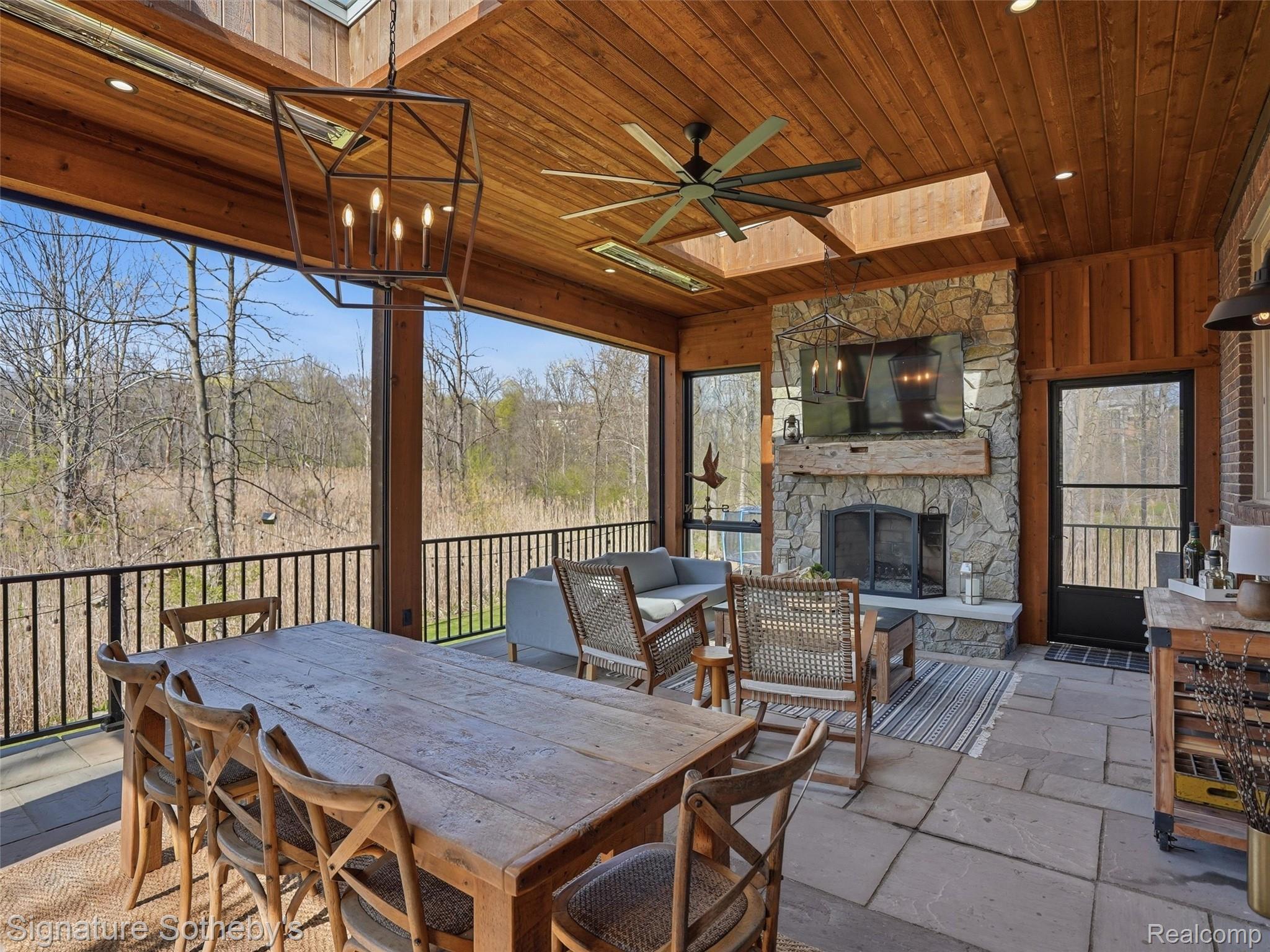 1595 Carriage Way Rochester, MI 48307 - Photo 50 of 78 View of patio featuring outdoor lounge area, a ceiling fan, and an outdoor stone fireplace