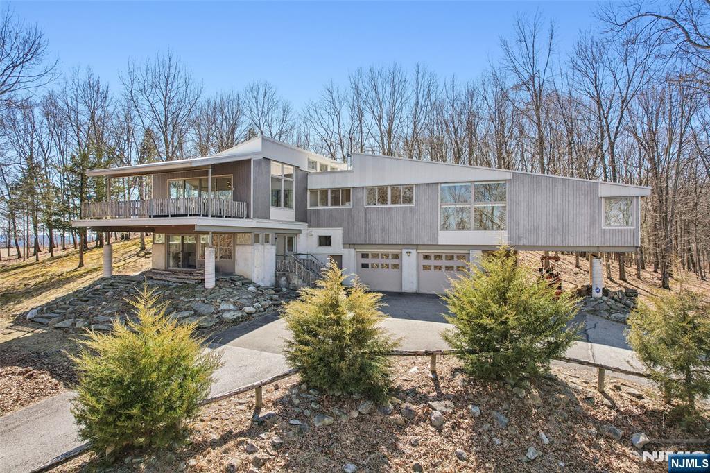 71 Sally Harden Road Sussex, NJ 07461 - Photo 1 of 33 a front view of a house with a yard and large trees