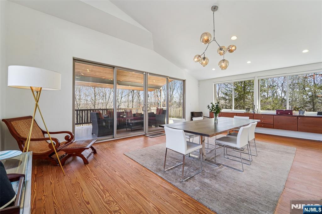 71 Sally Harden Road Sussex, NJ 07461 - Photo 11 of 33 a living room with furniture a flat screen tv and a large window