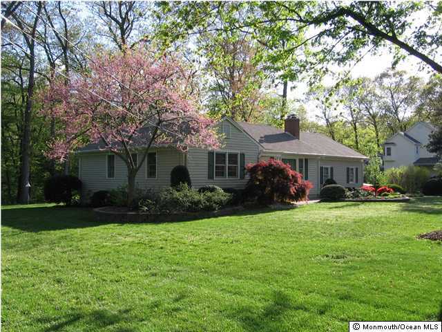 108 Manaqua Road Freehold, NJ 07728 - Photo 1 of 3 a front view of house with yard and green space