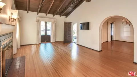 a view of livingroom with hardwood floor and hallway