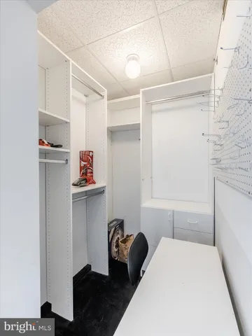 a bedroom with a bed and a desk