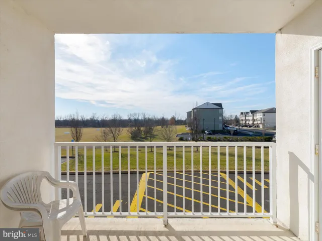 a view of a balcony with wooden floor