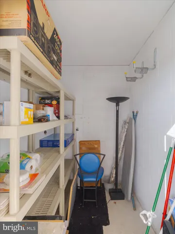 a dining room with furniture and a rug