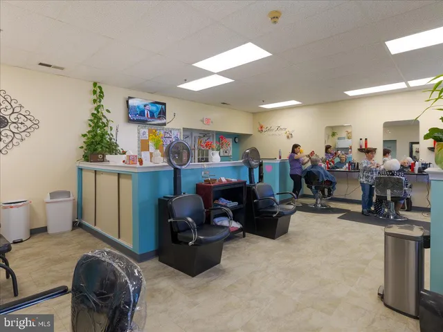 a room with gym equipment and a view of living room