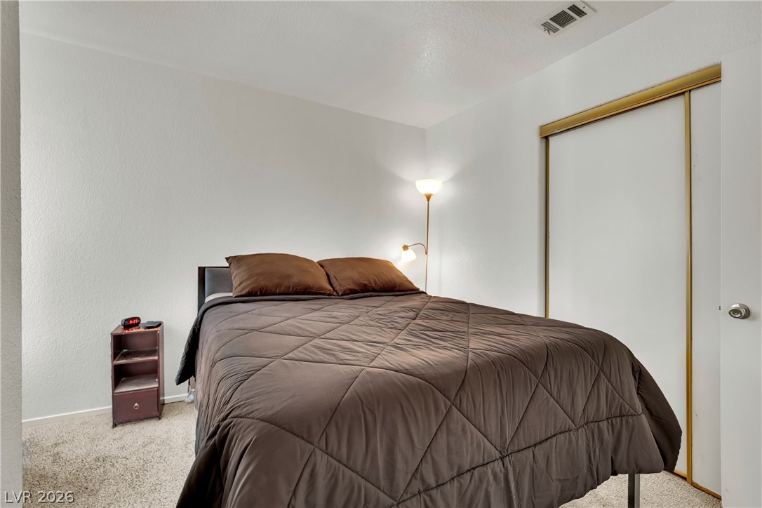 8057 Cimarron Ridge Drive Las Vegas, NV 89128 - Photo 22 of 28 Guest Bedroom