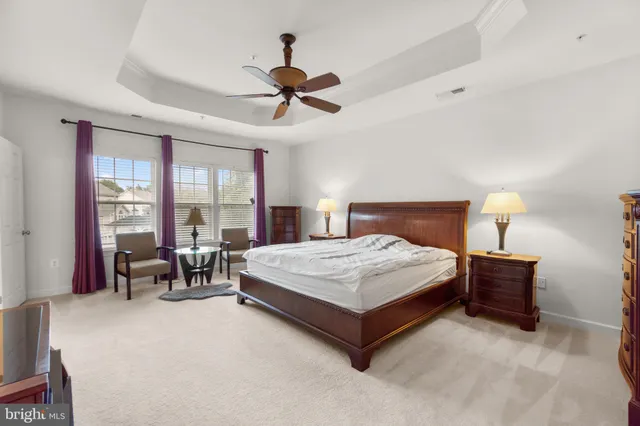 a view of a work space with wooden floor and a chair