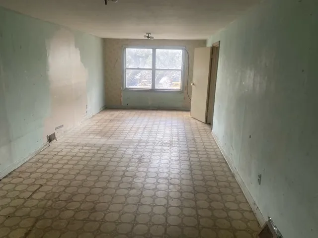 an empty room with windows