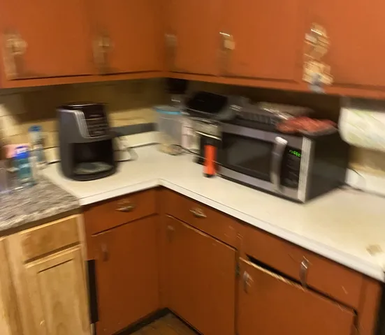 a kitchen with a sink and cabinets