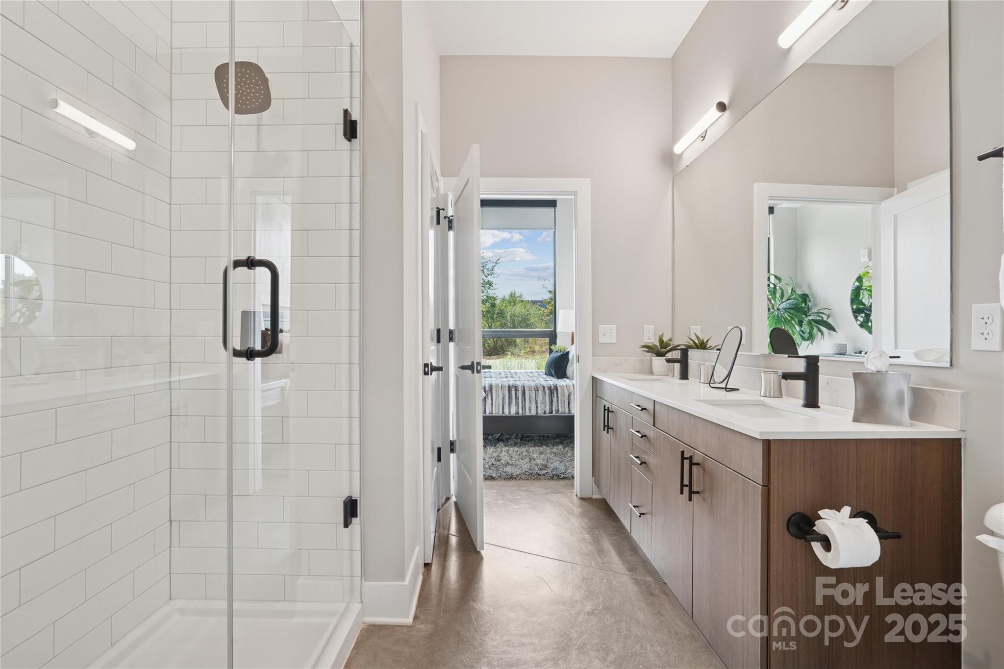110 Razades Way, Unit B2 Charlotte, NC 28206 - Photo 19 of 29 a bathroom with a double vanity sink and shower