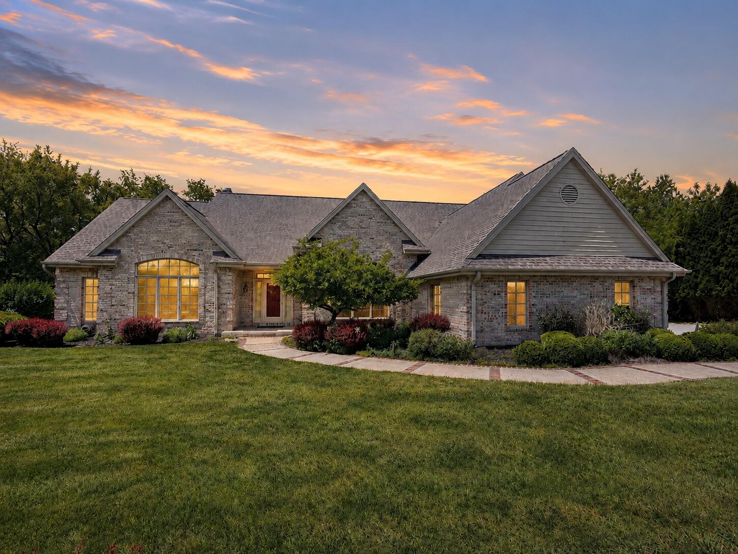 W291-s5245 Ridgefield Road Waukesha, WI 53189 - Photo 2 of 44 Original owner offers this Stunning custom brick ranch set on a beautifully landscaped 3-acre estate-sized lot in sought-after Ridgefield Bay. A dramatic front elevation, soaring rooflines, mature landscaping, and exceptional curb appeal create a memorable first impression. Nestled among mature trees, this executive home offers privacy, quality craftsmanship, and timeless architectural design. (Some photos are enhanced or stage)