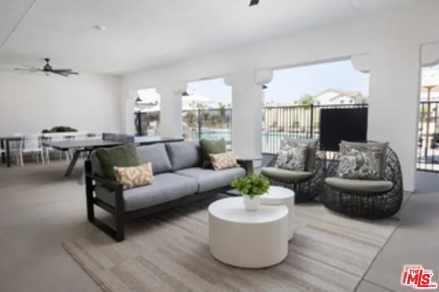 a living room with furniture and a large window