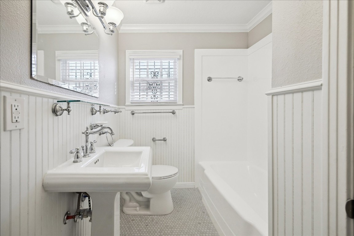 1115 Post Street Houston, TX 77022 - Photo 17 of 23 Completely remodeled bathroom with brand new marble floors.
