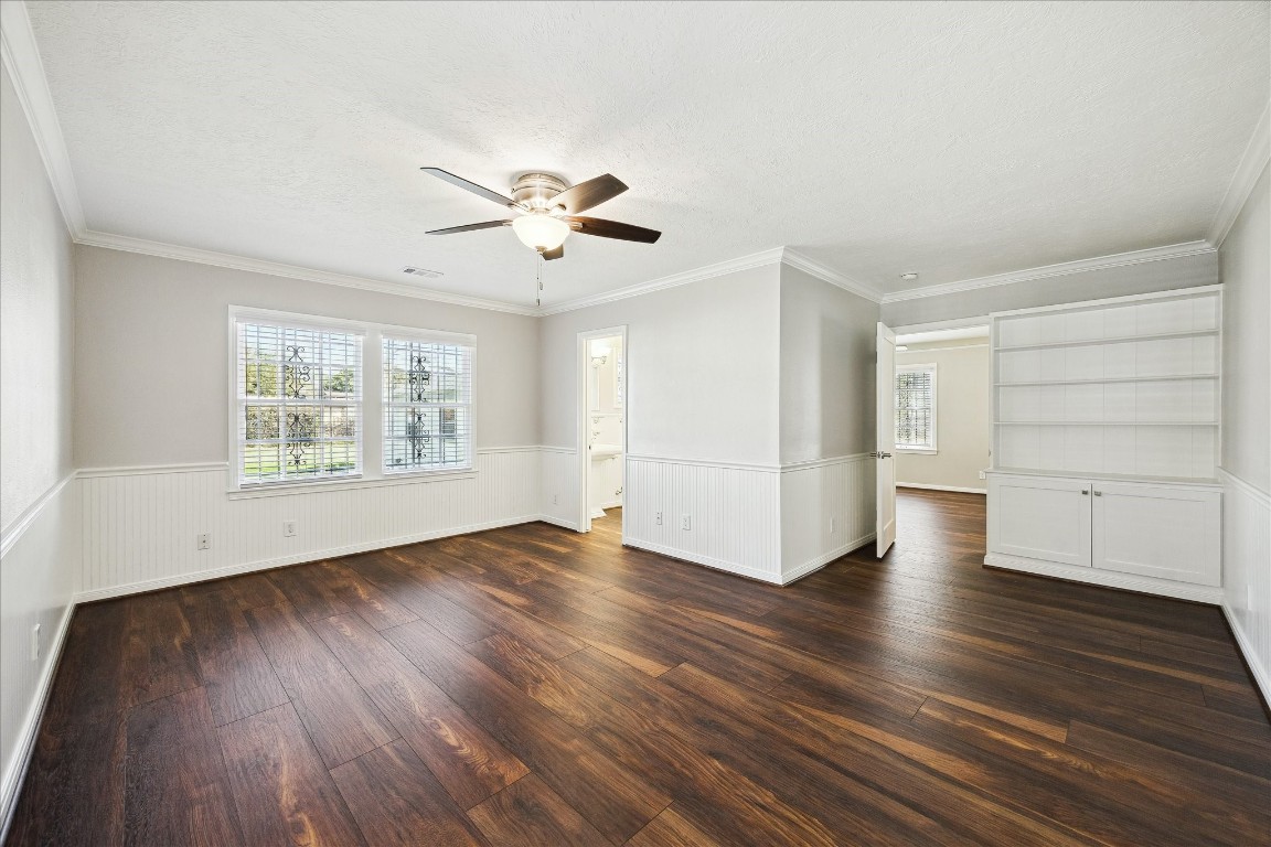 1115 Post Street Houston, TX 77022 - Photo 18 of 23 Gathering room with built-in and wonderful view of gigantic backyard.
