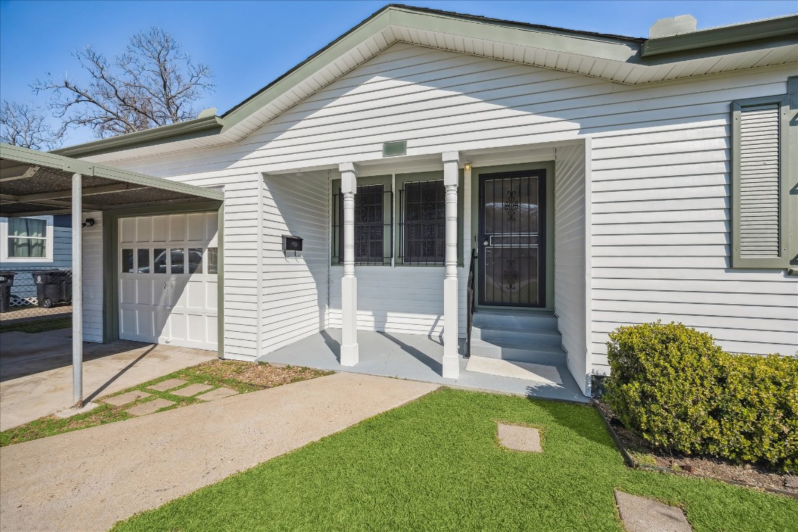 1115 Post Street Houston, TX 77022 - Photo 2 of 23 3 cars can park under the carport and single car garage.