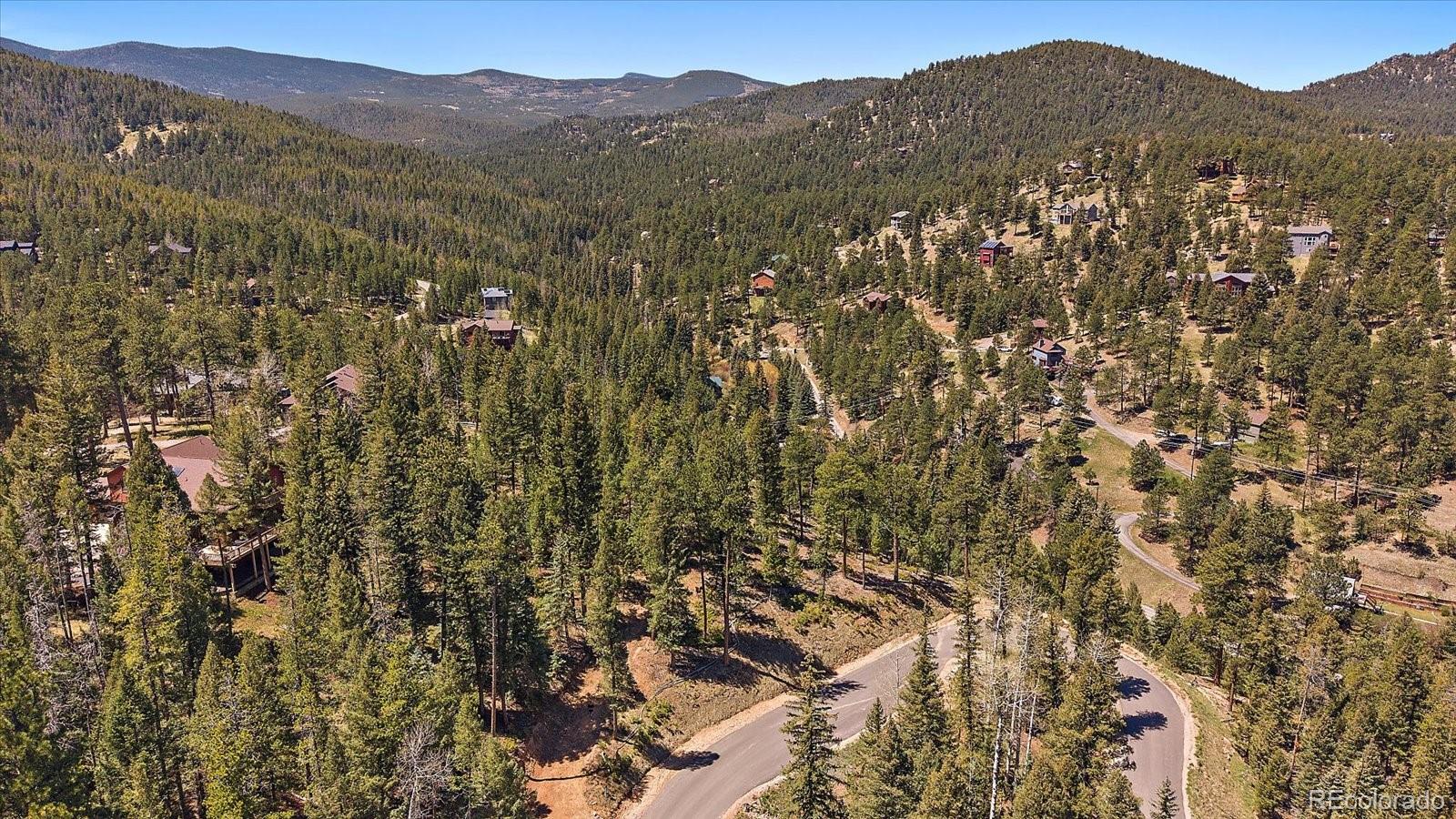 6855 Lynx Lair Road Evergreen, CO 80439 - Photo 8 of 21 a view of a city with mountain