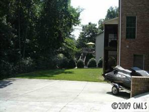 552 Beacon Knoll Lane Fort Mill, SC 29708 - Photo 3 of 7 a view of backyard with trampoline