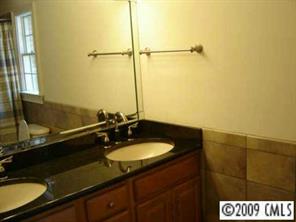552 Beacon Knoll Lane Fort Mill, SC 29708 - Photo 4 of 7 a bathroom with a sink and a mirror