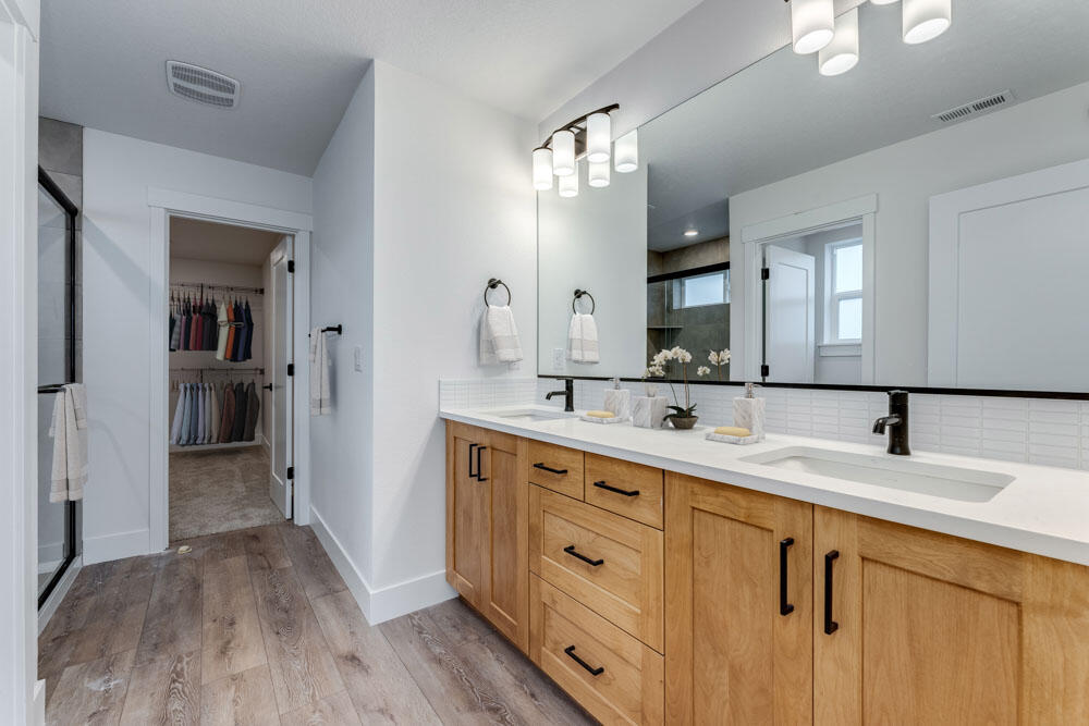 3907 Northeast Oakside Loop Bend, OR 97701 - Photo 8 of 23 Primary bath - This is virtually staged and colors may vary.