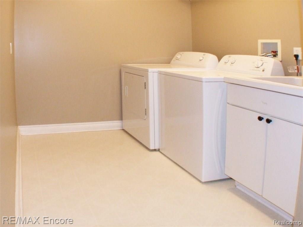 8629 Sashabaw Road Clarkston, MI 48348 - Photo 20 of 34 Laundry room with so much space!