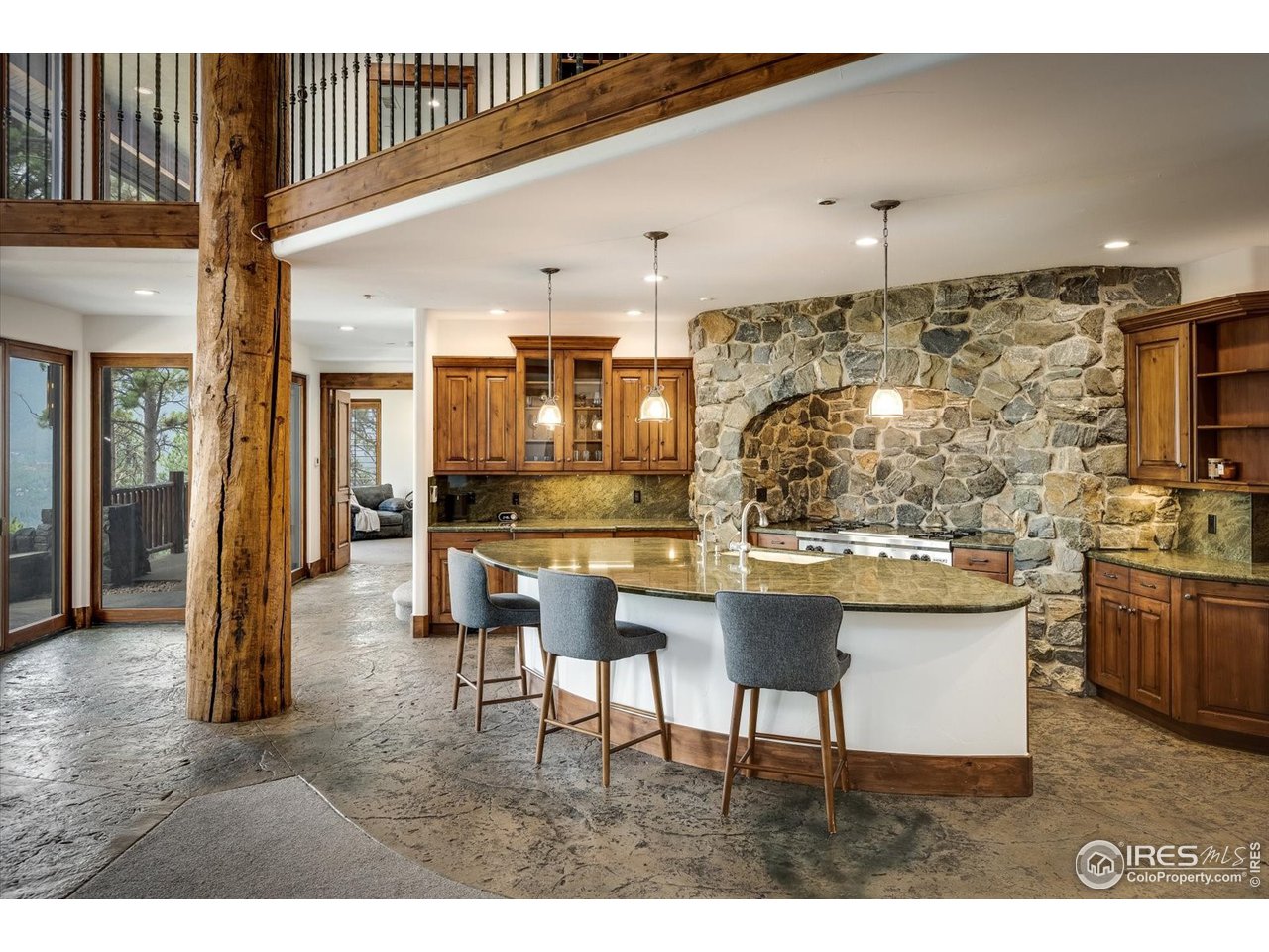 34750 Fox Ridge Road Evergreen, CO 80439 - Photo 11 of 39 Open kitchen with island. Reading balcony above.