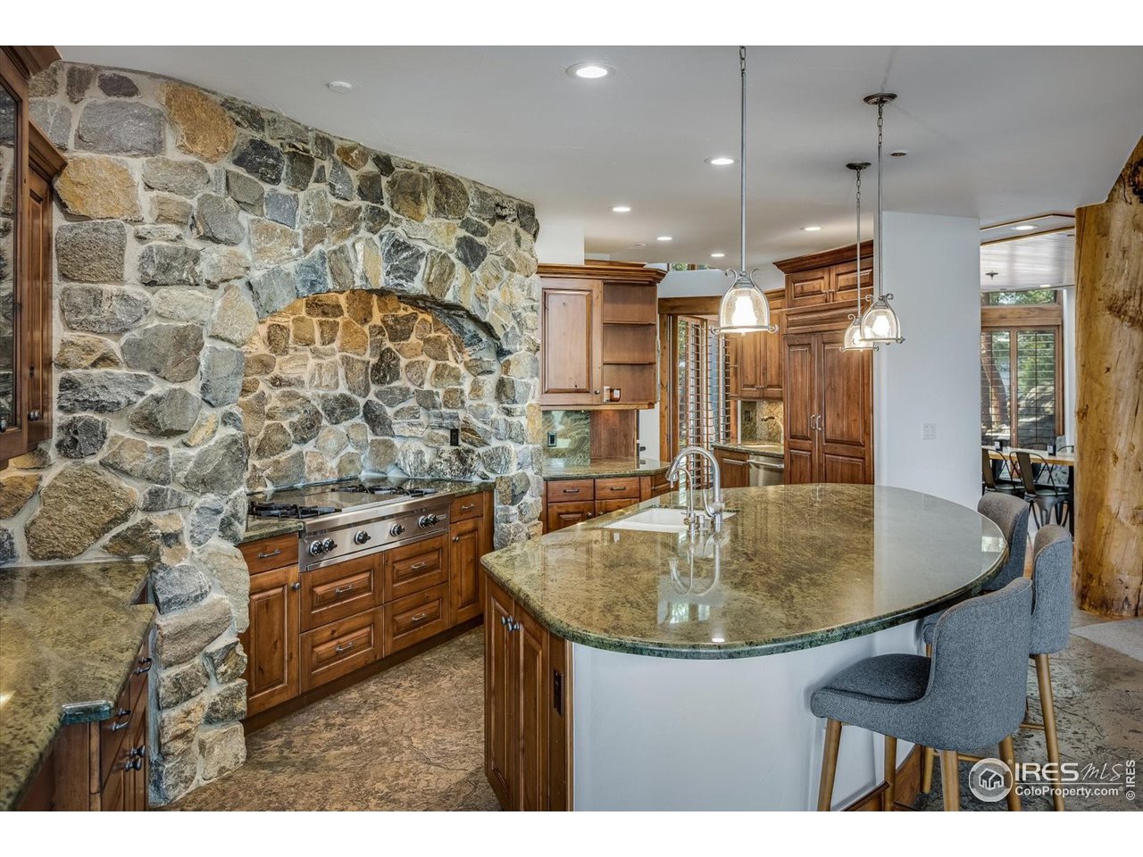 34750 Fox Ridge Road Evergreen, CO 80439 - Photo 12 of 39 Chef's kitchen with double ovens, 48" Wolf cooktop, dual dishwashers, pro-fridge, and walk-in pantry.