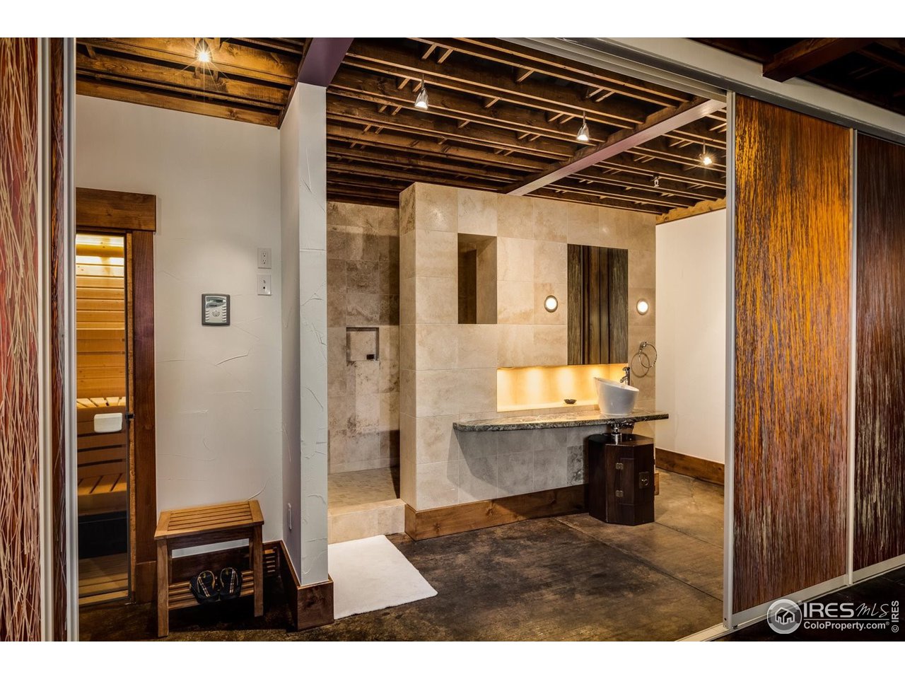 34750 Fox Ridge Road Evergreen, CO 80439 - Photo 17 of 39 Zen spa area with sauna, shower, and gym area.