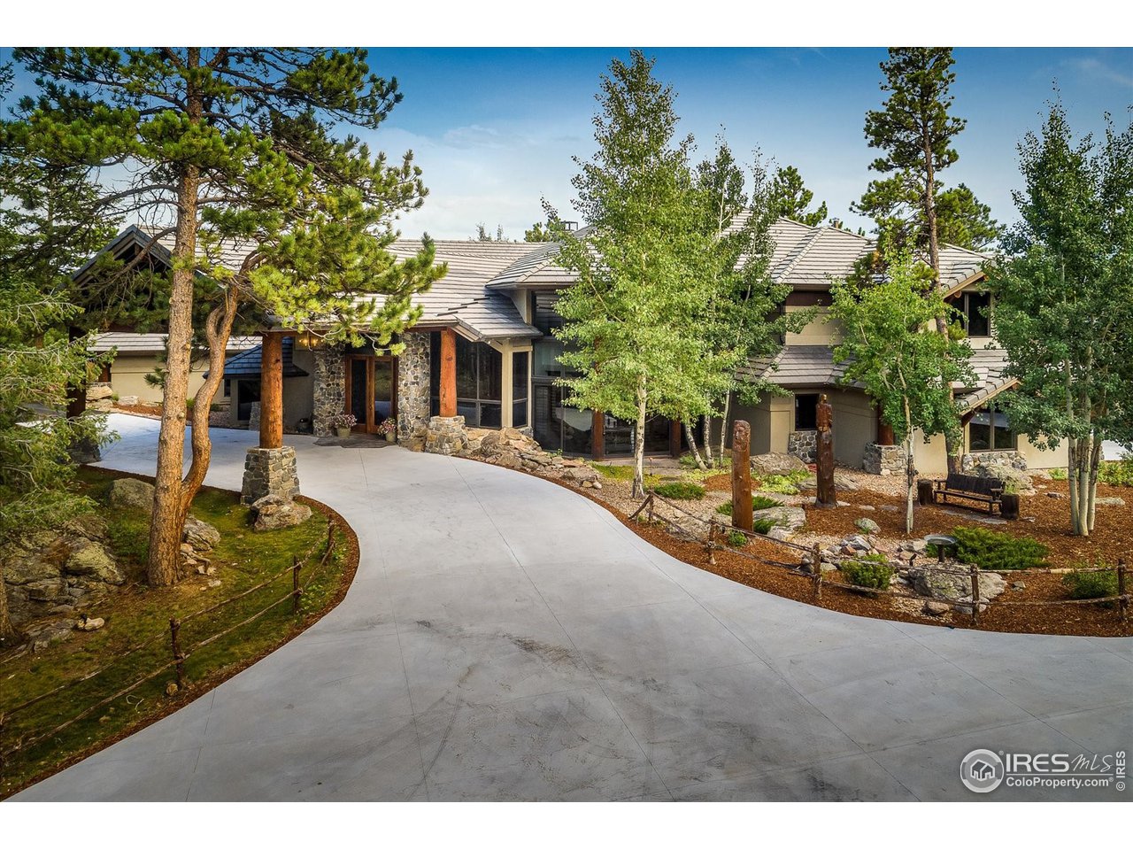 34750 Fox Ridge Road Evergreen, CO 80439 - Photo 35 of 39 Entry: Two separate attached two-car garages are located on the side of the home, and provide a direct entry into the kitchen/pantry area.