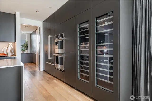 a view of kitchen with stainless steel appliances and cabinets
