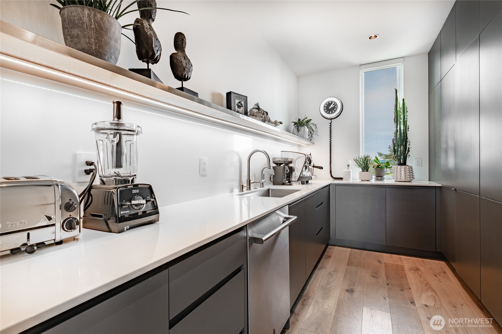 9545 Semiahmoo Parkway, Unit 201 Blaine, WA 98230 - Photo 13 of 40 a kitchen with a sink a stove and cabinets