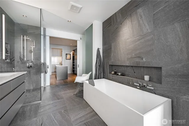 a large bathroom with a double vanity sink a mirror and a shower