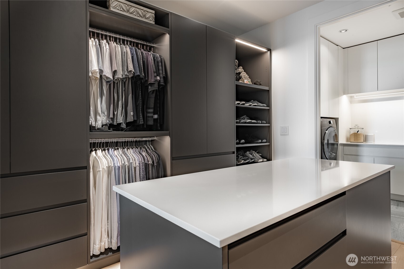 9545 Semiahmoo Parkway, Unit 201 Blaine, WA 98230 - Photo 22 of 40 a view of kitchen island with cabinets and refrigerator