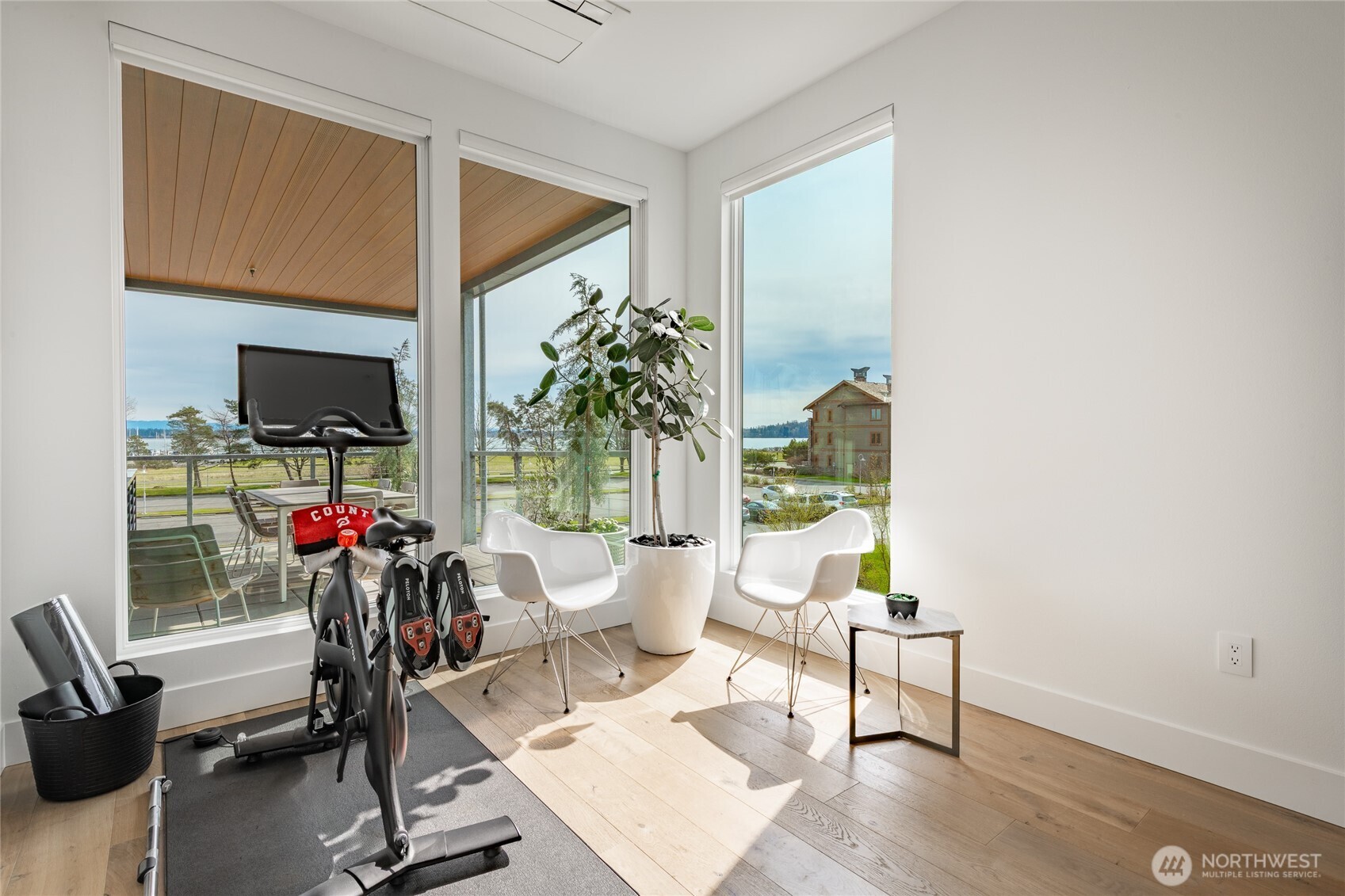 9545 Semiahmoo Parkway, Unit 201 Blaine, WA 98230 - Photo 28 of 40 a living room with furniture and a potted plant
