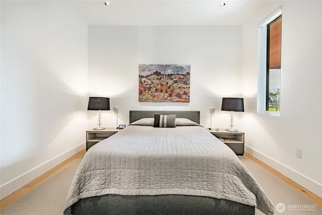 a bathroom with a toilet a sink and a mirror