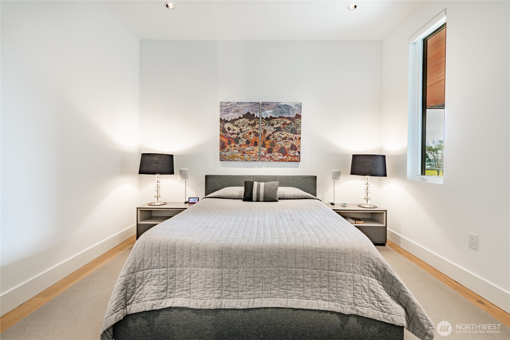 9545 Semiahmoo Parkway, Unit 201 Blaine, WA 98230 - Photo 31 of 40 a bedroom with a bed and a night stand