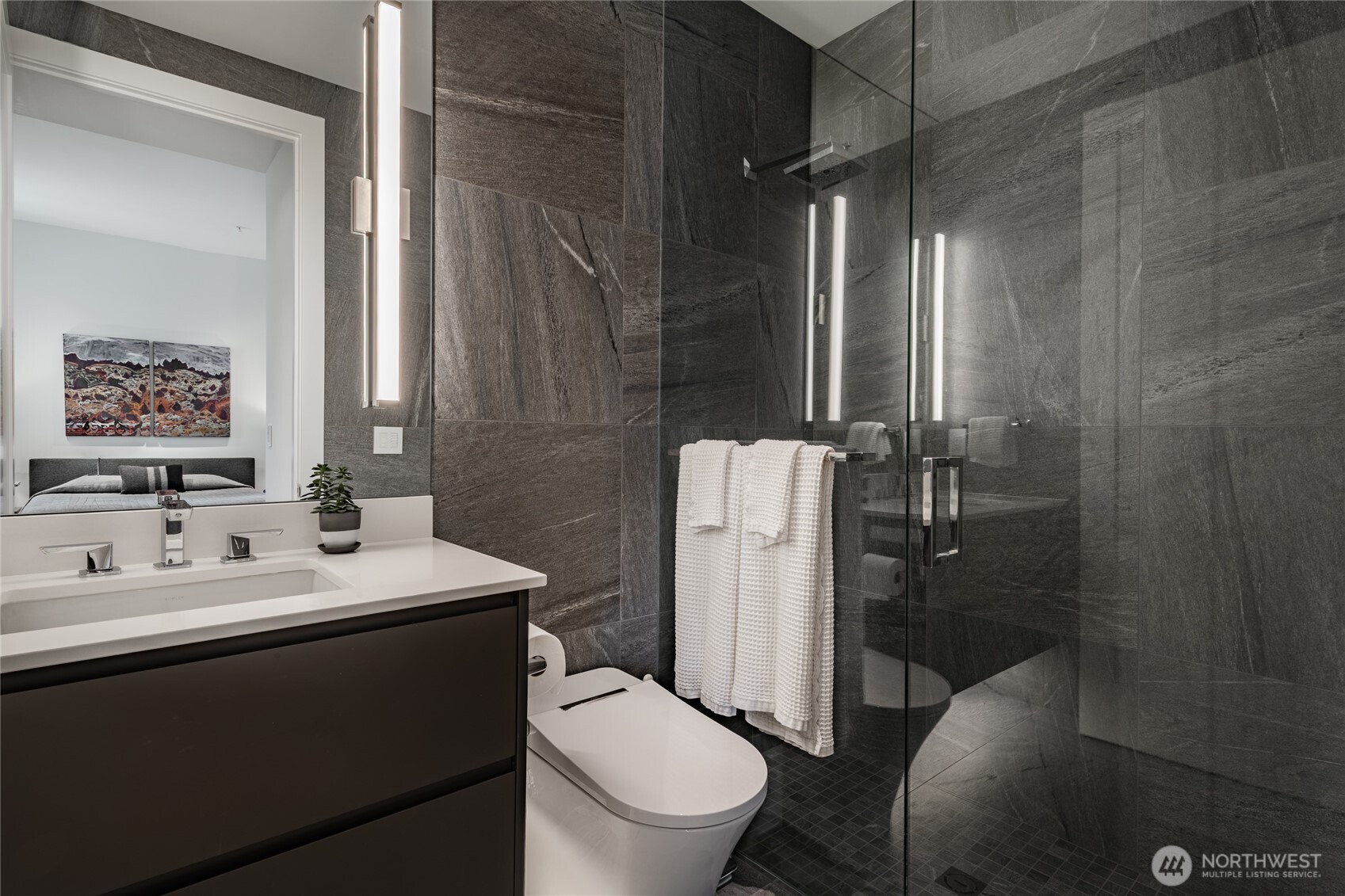 9545 Semiahmoo Parkway, Unit 201 Blaine, WA 98230 - Photo 32 of 40 a bathroom with a toilet a sink and a mirror