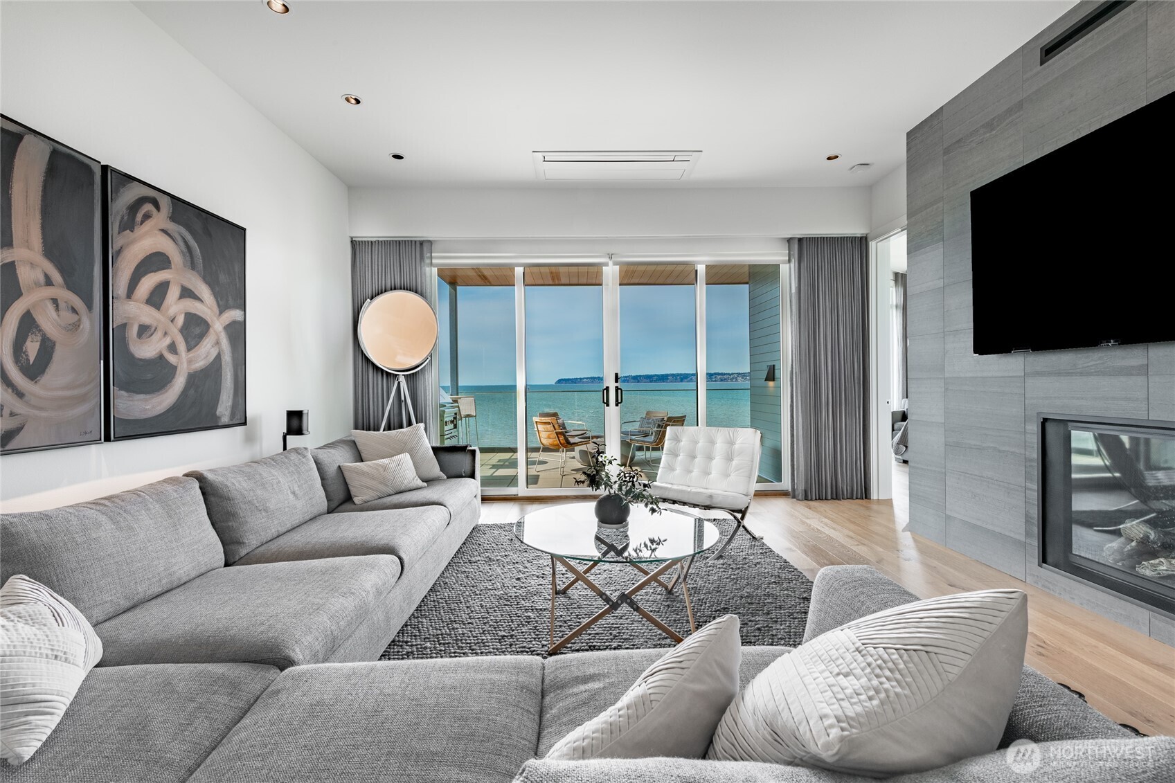9545 Semiahmoo Parkway, Unit 201 Blaine, WA 98230 - Photo 4 of 40 a living room with fireplace furniture and a flat screen tv