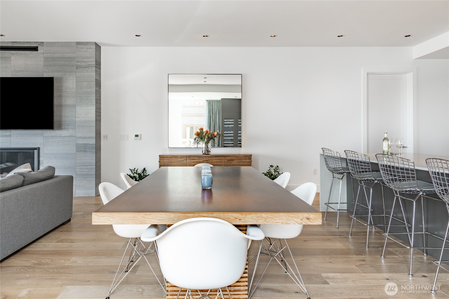 9545 Semiahmoo Parkway, Unit 201 Blaine, WA 98230 - Photo 9 of 40 a living room with furniture a flat screen tv and kitchen view