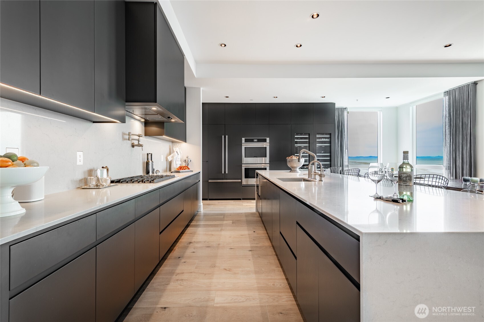 9545 Semiahmoo Parkway, Unit 201 Blaine, WA 98230 - Photo 10 of 40 a large white kitchen with stainless steel appliances