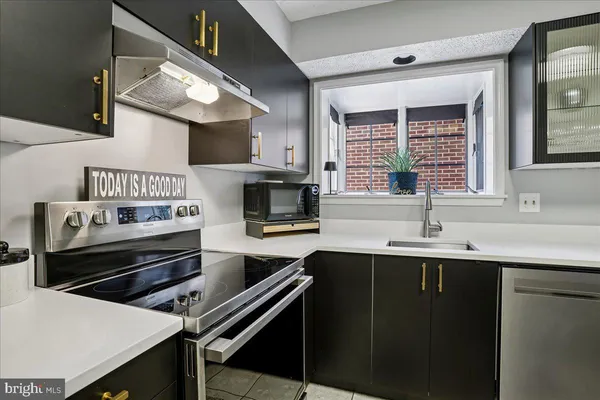 a kitchen with a stove and a sink