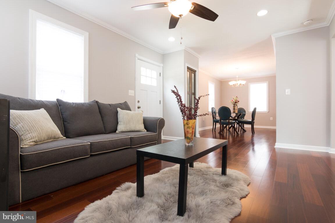 3613 Forest Hill Road Baltimore, MD 21207 - Photo 3 of 27 a living room with furniture and wooden floor