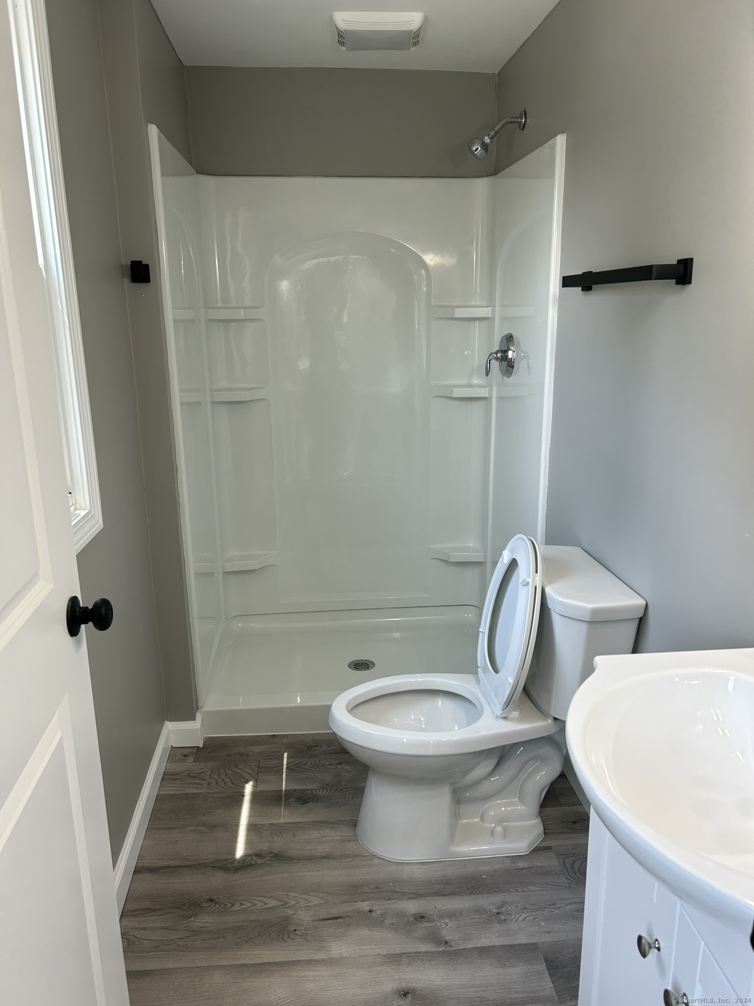 38 Beecher Street Southington, CT 06489 - Photo 10 of 12 a white toilet sitting next to a shower