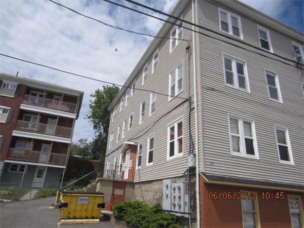 177 Nashua Street, Unit 5 Fall River, MA 02721 - Photo 1 of 15 a front view of a building with a street