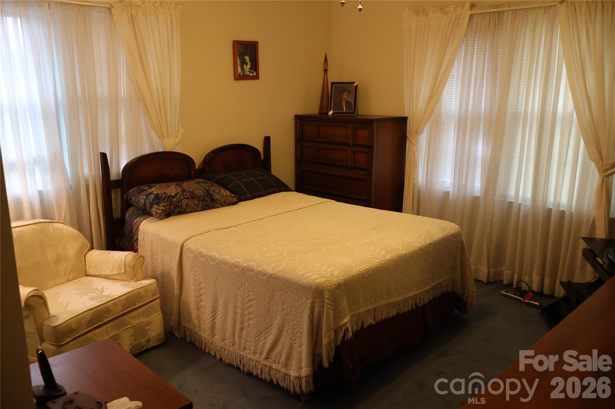 1529 West Market St Extension Cheraw, SC 29520 - Photo 11 of 38 a bedroom with a bed and wooden floor