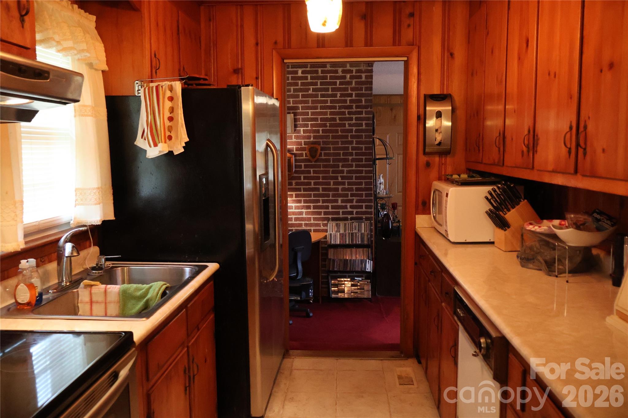 1529 West Market St Extension Cheraw, SC 29520 - Photo 14 of 38 a kitchen with a sink and refrigerator